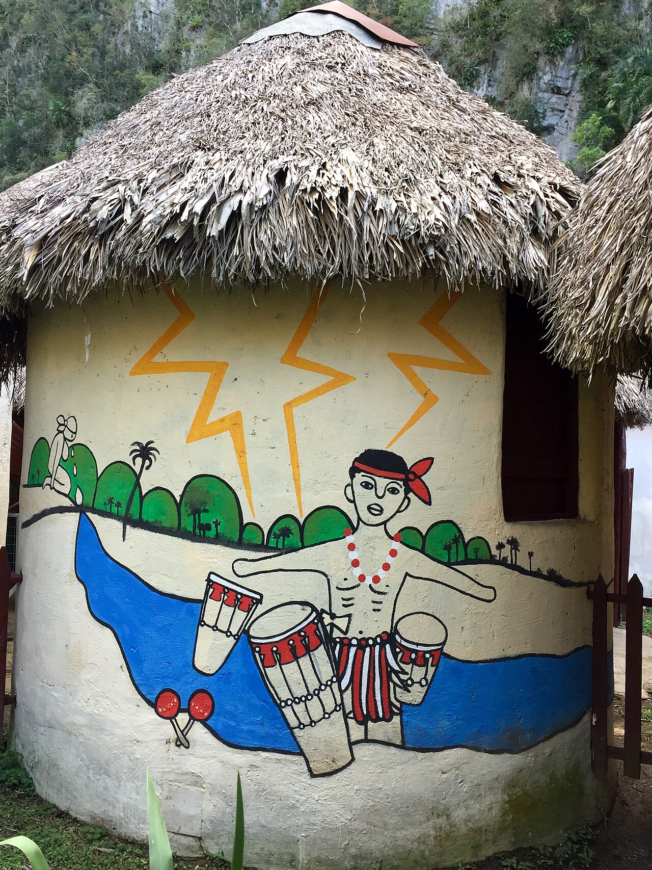 Mural cubano en bohío: músico con tambores y paisaje caribeño — Abderrahman Ait Ali