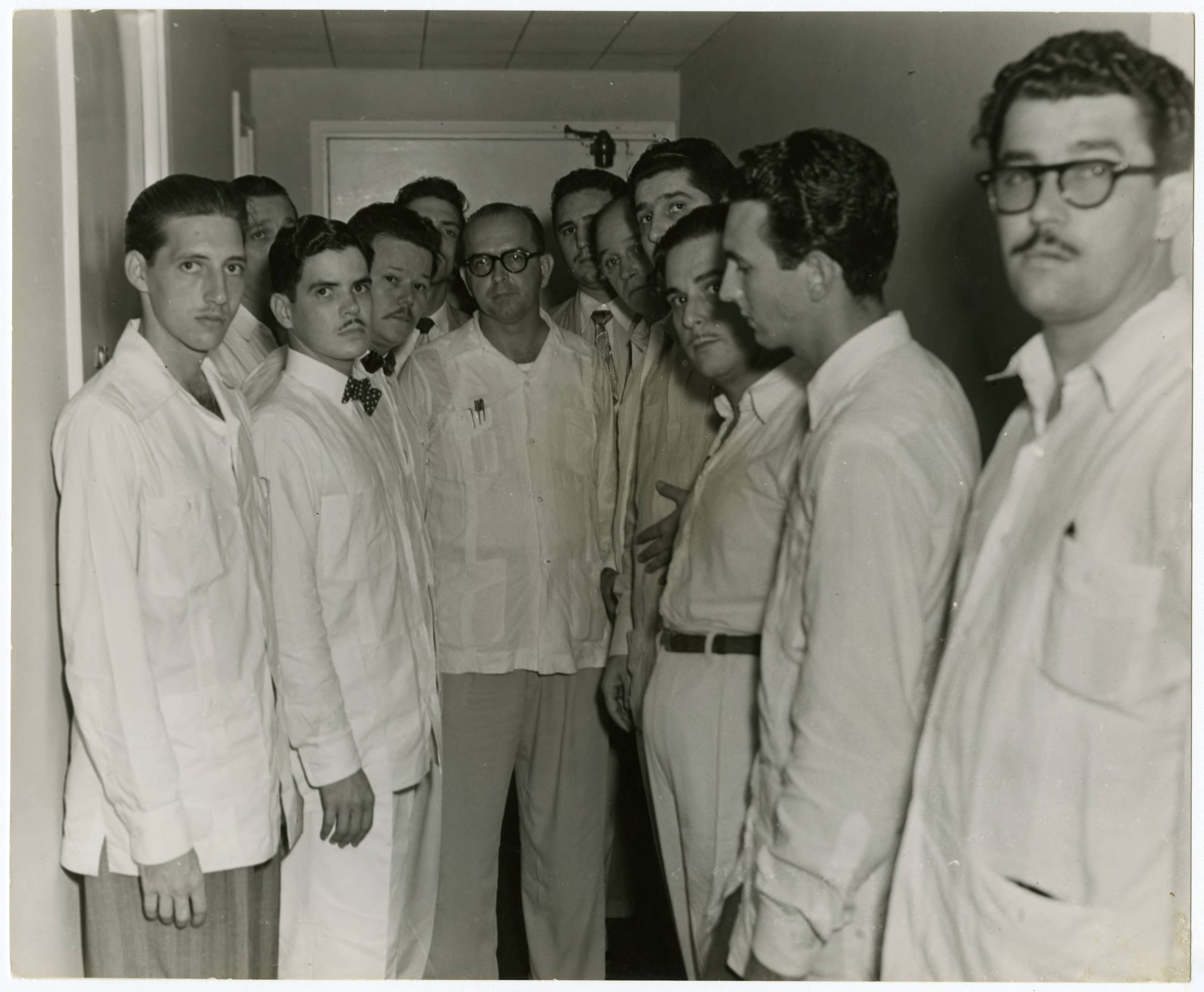 Fidel Castro (seen in background at right) with leaders of the Partido Ortodoxo (Orthodox Party) meeting in New York — Raúl Chibás