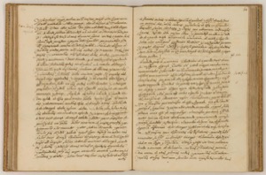 Manuscrito antiguo abierto que presenta dos páginas de texto escrito