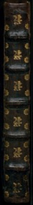 Lomo de libro antiguo con decoración dorada de leones y flores — Bernardino de Sahagún