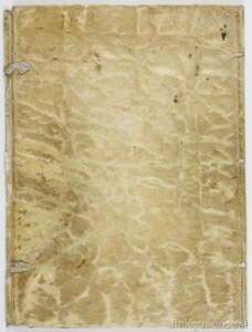 Portada desgastada de un libro antiguo con veta marmoleada