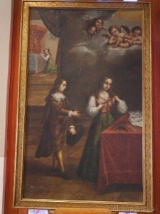 Escena religiosa con figuras y querubines