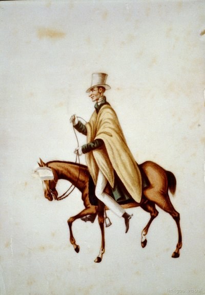Hombre con poncho y sombrero a caballo