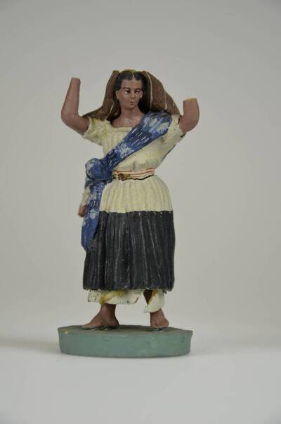 Figura costumbrista de mujer con fardo de bebé